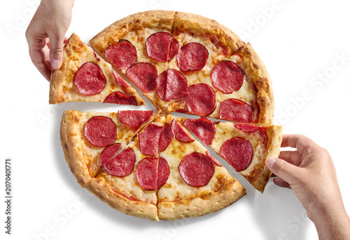 Hand Taking a Slice of Freshly Baked Pepperoni Pizza Isolated on White background