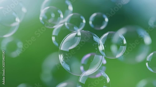 Floating soap bubbles against a soft green background. Bubbles symbolize joy, playfulness, and the essence of childhood wonder