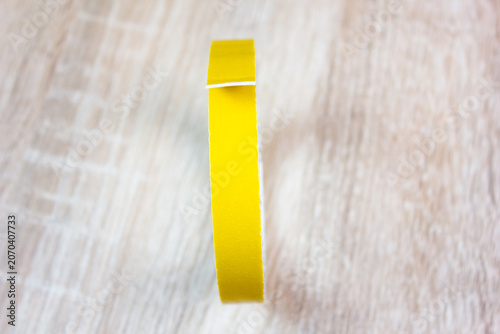 Double-sided tape, adhesive tape. A roll of tape for fixing and sealing.