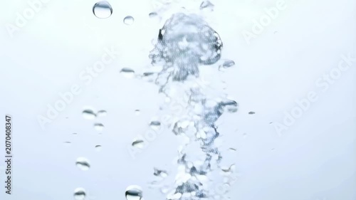Bubbles rising in clear water, creating a serene and calming atmosphere. Ideal for relaxation and wellness themes