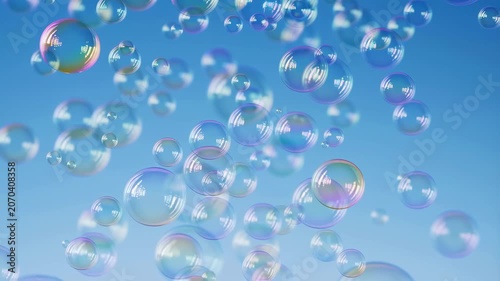 Colorful soap bubbles floating in a clear blue sky. Represents joy, playfulness, and the essence of childhood wonder