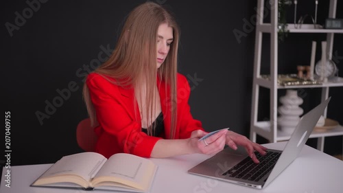 Young businesswoman making online payment with credit card