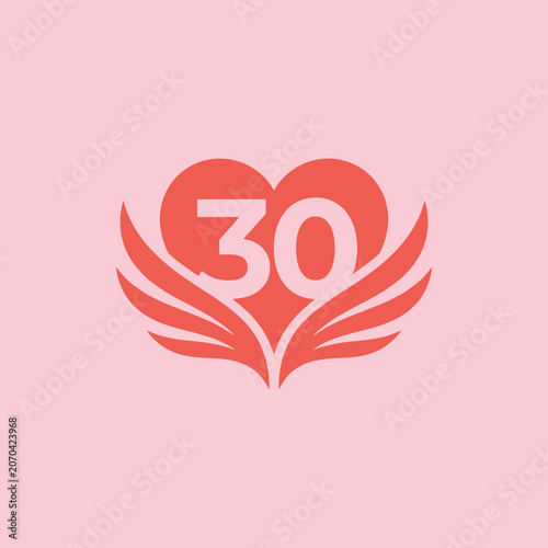 Fotografie A pink heart with wings celebrates a thirtieth anniversary