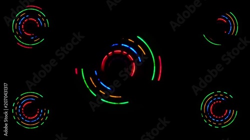 Circles of light, a collection of glowing, colorful neon circular patterns set against a black background, electron spin
