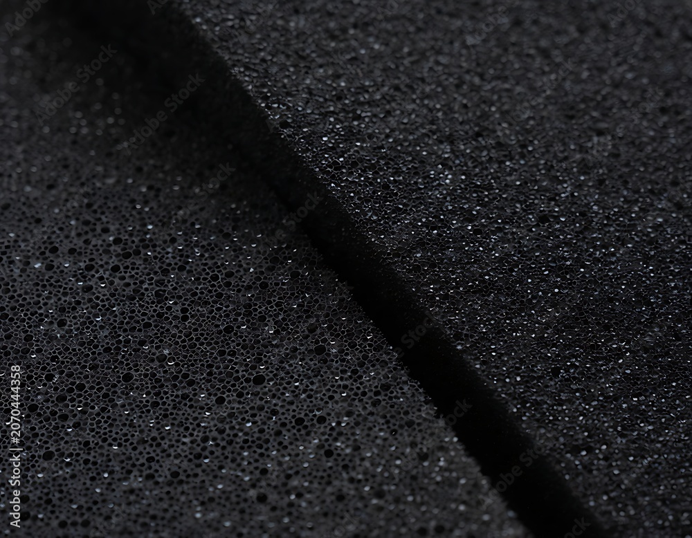 Fototapeta premium Close-up view of dark textured surface with shadow.