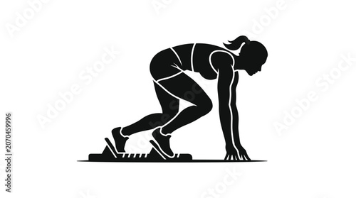 Female athlete in starting blocks ready to run a race.