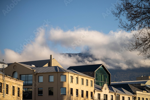 Modern and Heritage Buildings in Hobart with Misty Mount Wellington Background