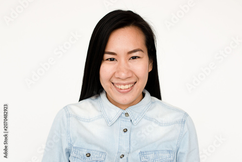 Bild auf Leinwand Smiling woman in denim shirt.