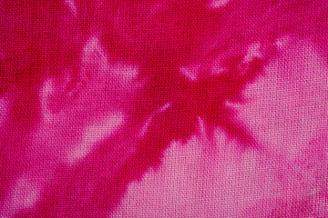Macro view of pink tie dye fabric texture