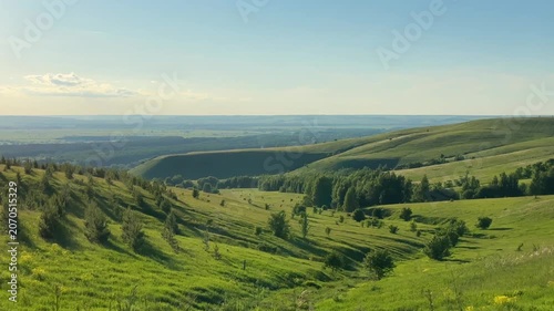 Hills and meadow landscape at the sunset