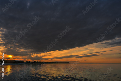 Evening atmosphere during a picturesque sunset at the beach in Boltenhagen on the Baltic Sea.