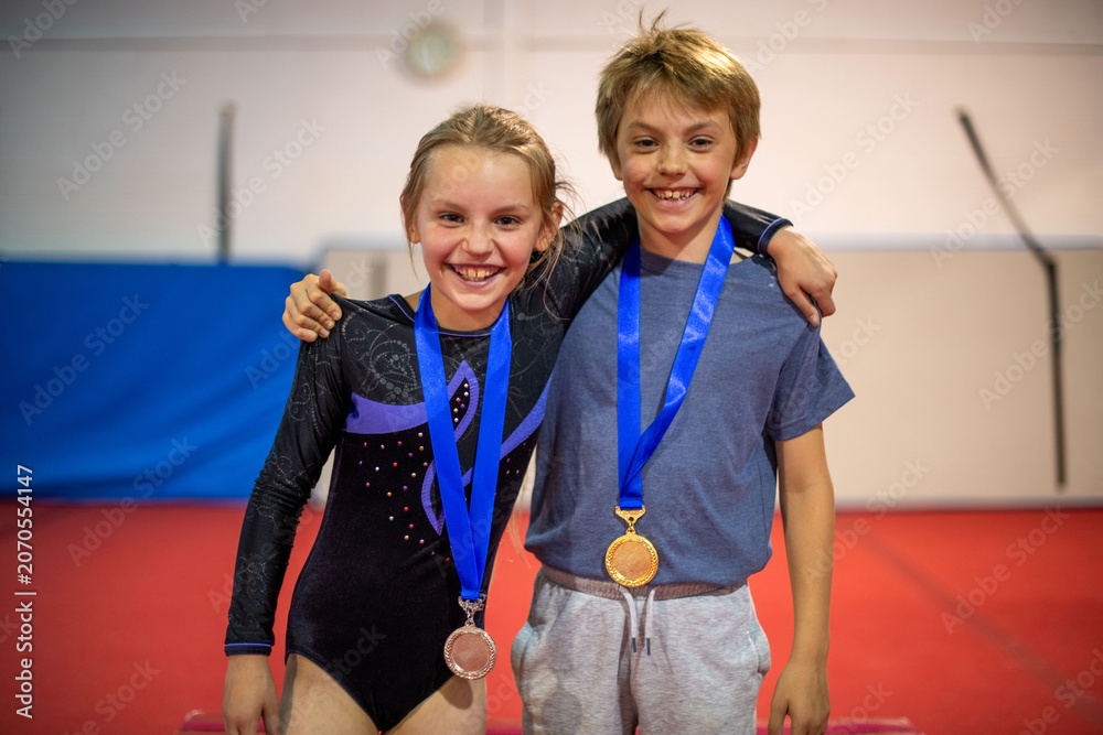 Fototapeta premium Young gymnasts celebrating victory together.