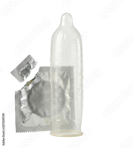 фотографія Unrolled clear condom standing next to torn foil wrapper