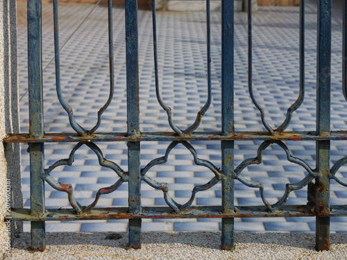 old rusty iron fence with metal bars
