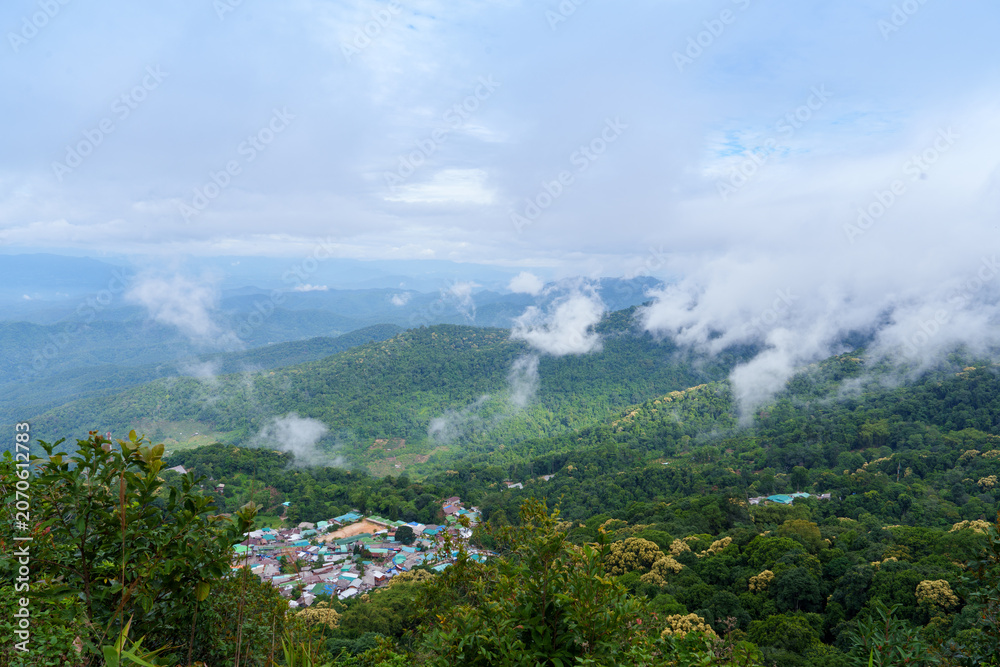 Obraz premium Doi pui hmong village mountain mist green forest landscape nature sky clouds peaceful Thailand