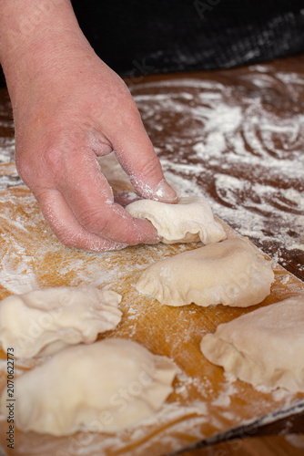 Принти на полотні Traditional Eastern European dumplings prepared by hand with fresh dough and che