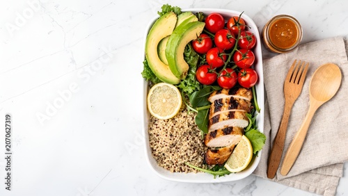 Overhead flat lay of colorful healthy breakfast bowl with fresh fruits and granola