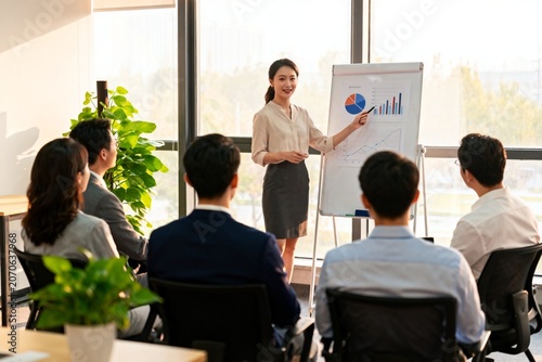 Businesswoman presenting data to colleagues