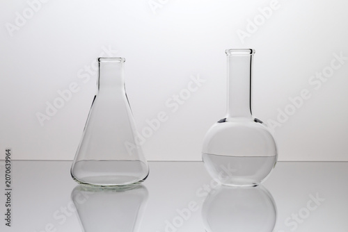 A set of empty chemical flasks on a white background