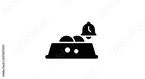 Fényképezés Black bell on a rectangular object.