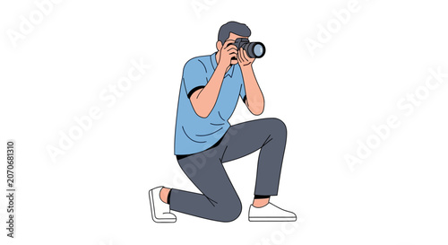 A man kneels down to take a photograph with his camera.