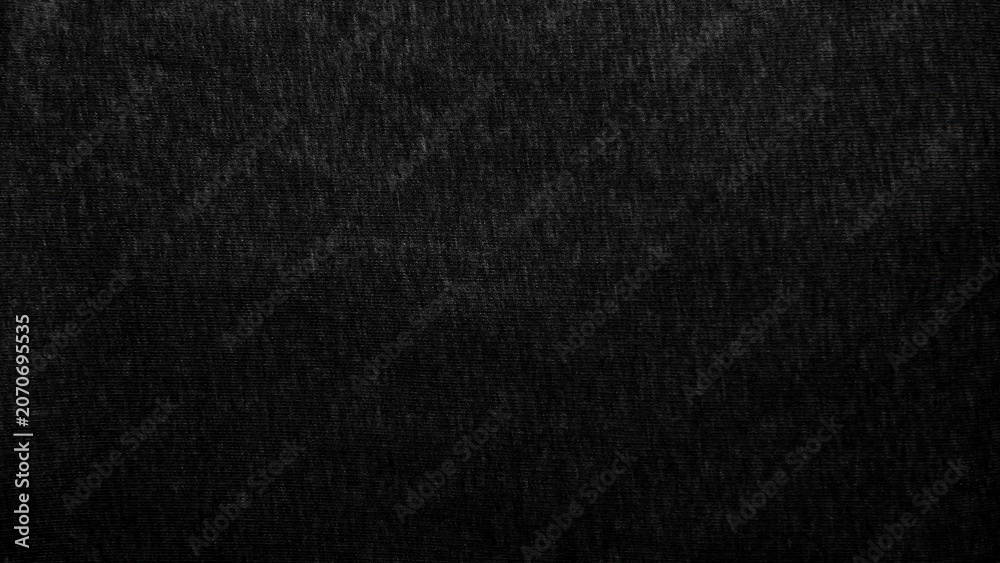 Fototapeta premium black cotton fabric texture reveals organic woven pattern in minimalist moody lighting