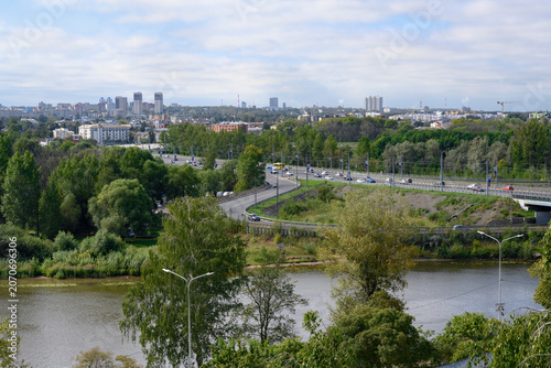 Aerial view of the Kotorosl River, parks, buildings and pipes of factories in Yaroslavl, Russiaб decorated with flags with the coat of arms of the city