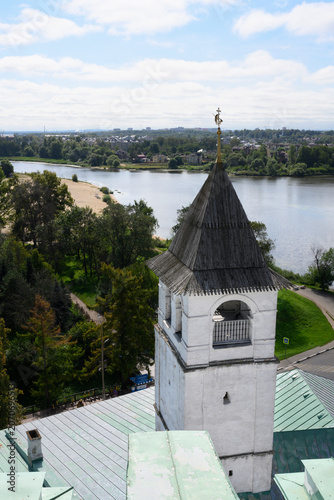 Medieval brick tower with wooden roof and weather vane in Yaroslavl, Russia