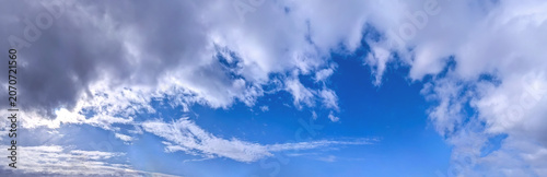 Fotografie A raster image of a some cloud photographed against a blue sky
