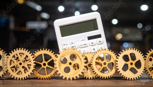 Calculator with wooden gears on desk