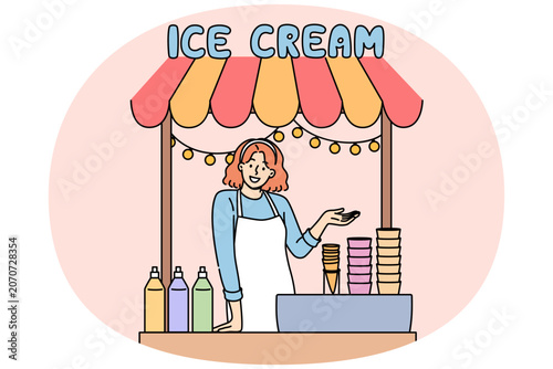 Woman sells ice cream in street stall and makes gesture inviting you to try cold dessert. Girl selling ice cream in waffle cones with addition of sweet syrups to quench summer thirst