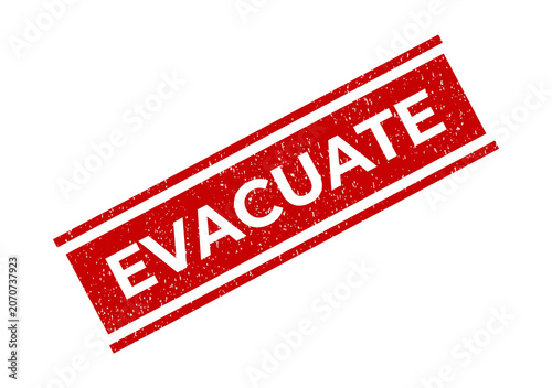 Foto Red rubber stamp with the word evacuate in a grunge texture style