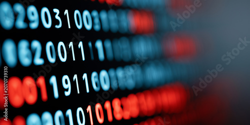 Abstract digital binary code with glowing red and blue numbers blurred on a dark computer monitor.