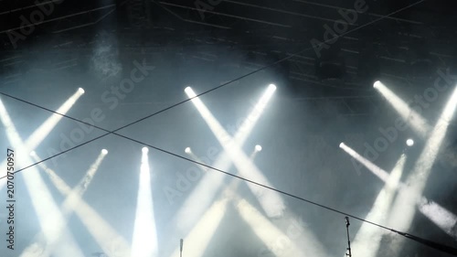 Empty stage lighting with swirling smoke effects