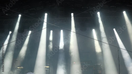 Empty stage lighting with swirling smoke effects