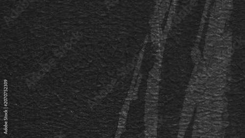 Fotografie Dark textured desktop wallpaper with a crumpled paper effect and subtle shadow l