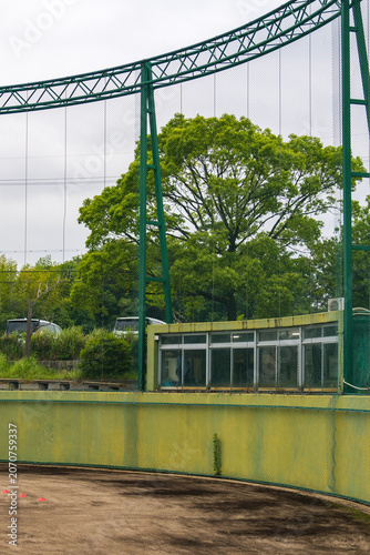 Protective net and fence around baseball field