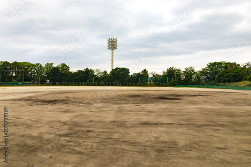 Empty baseball ground with floodlight tower