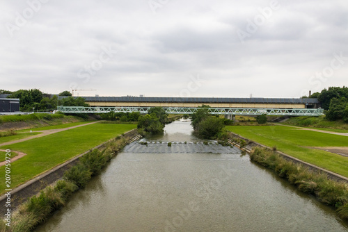 River landscape with bridges under cloudy sky