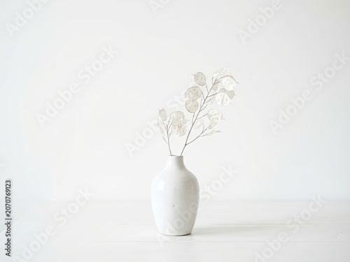 Labor day decor inspiration minimalist white vase with dried flowers