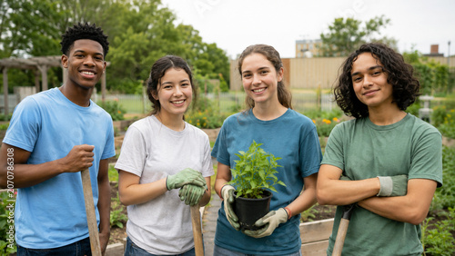 Diverse youth volunteer group portrait in community garden