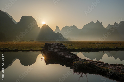 Sunrise Reflection Over Karst Mountains in Guilin