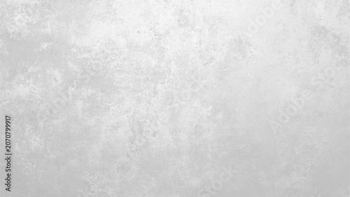 Gray textured wall surface with white patches and subtle gradient effect one sentence