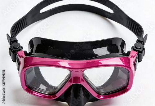 Pink and black swimming goggles on white background