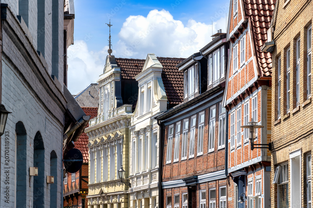 Obraz premium Stade, Germany, historic old town lane with richly decorated facades, timber framed houses and northern German architecture