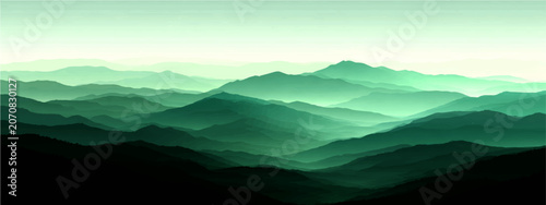 Obraz na płótnie Misty emerald mountain range, shrouded ethereal atmospheric haze, evokes a sense of profound serenity and the majestic beauty of untouched wilderness