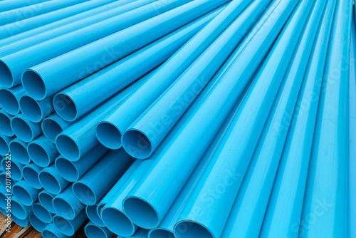 Foto Perspective View of Stacked Pipes Extending into Distance