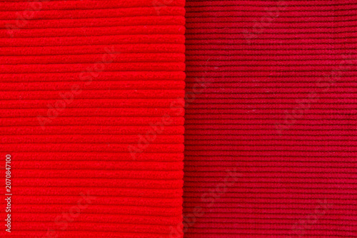 Bild auf Leinwand Red and burgundy corduroy fabrics comparison showing fine and wide wale textures