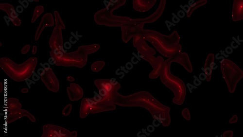 Red blood cells floating in dark background