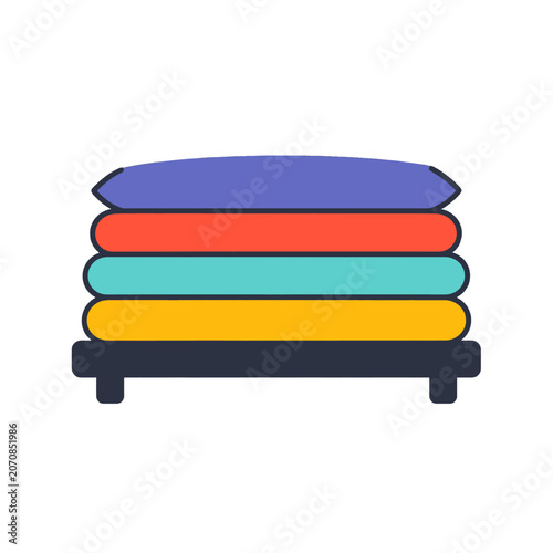 Stack of colorful folded textiles on a dark surface